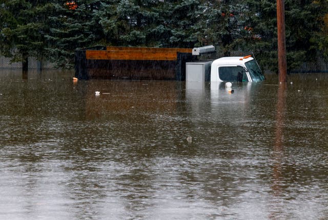 <p>A truck is submerged in flood water in New York after a major storm </p>