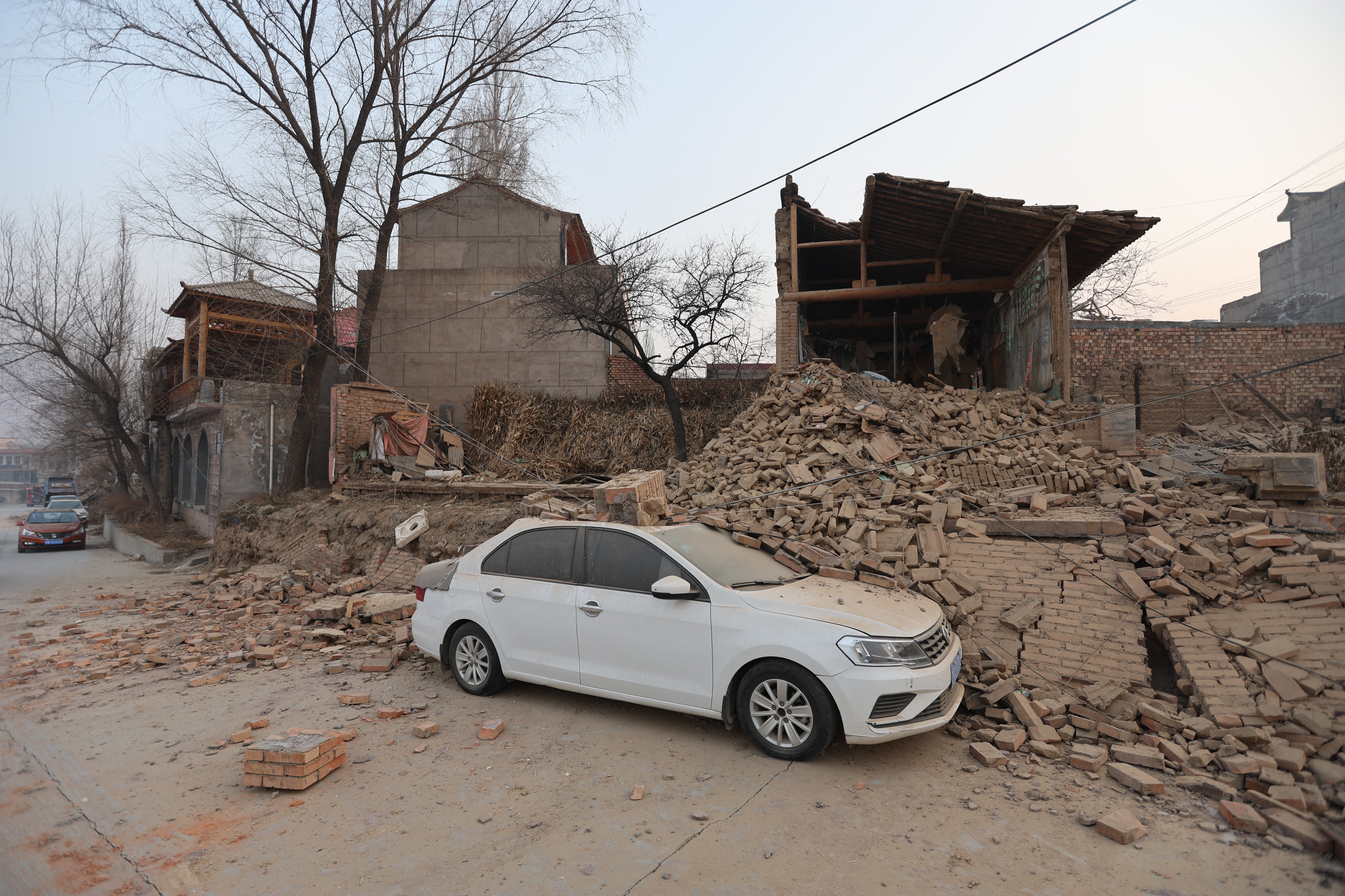 Collapsed buildings are seen after an earthquake in Dahejia