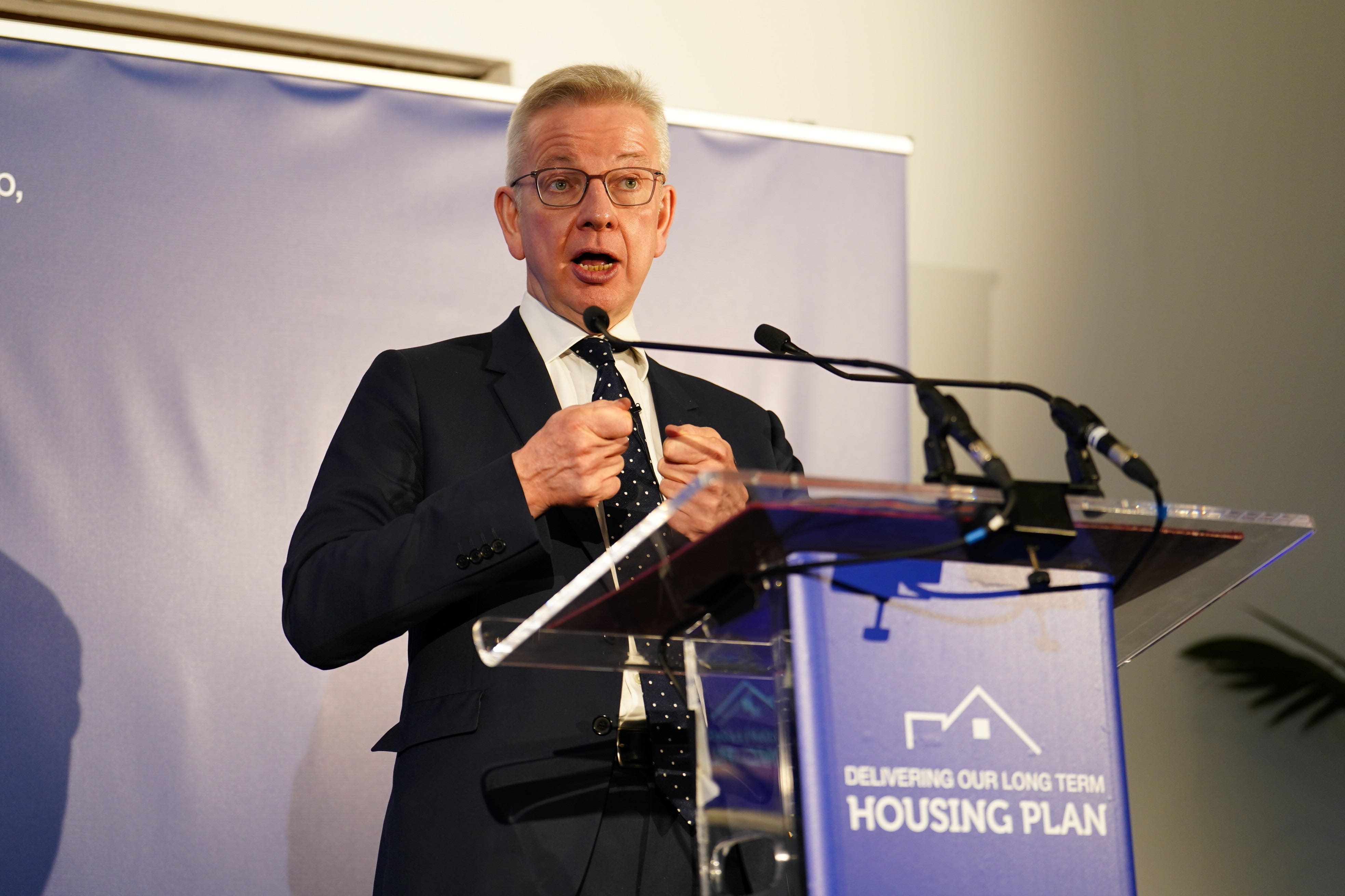 Housing Secretary Michael Gove makes a speech in central London on how he plans to speed up the planning system (Jordan Pettitt/PA)