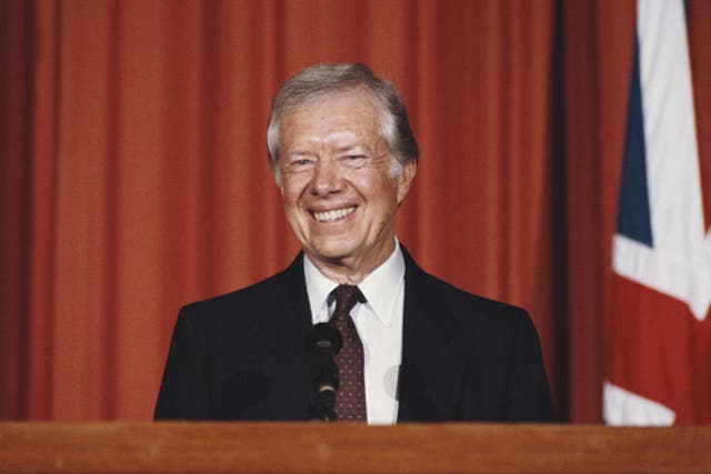 <p>Former US President Jimmy Carter holds a press conference at the American Embassy in London, UK, in 1986</p>