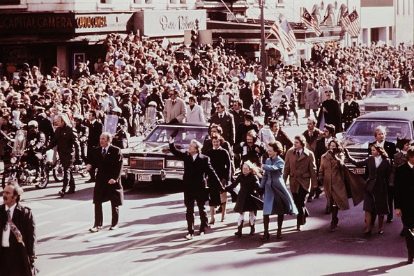 Newly-elected president Jimmy Carter walks hand in hand with his wife Rosalynn Carter and his daughter Amy Carter on January 21, 1977, in Washington, D.C.