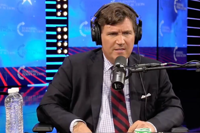<p>Tucker Carlson during a live discussion hosted by Tim Pool at Turning Point USA’s AmericaFest</p>