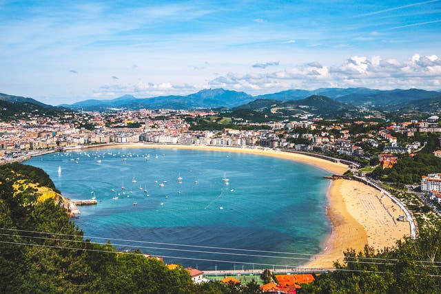 <p>Golden sand and green hillsides border San Sebastian</p>