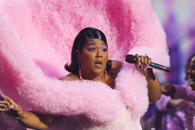 <p>Lizzo photographed performing at the Brit Awards in Febuary </p>