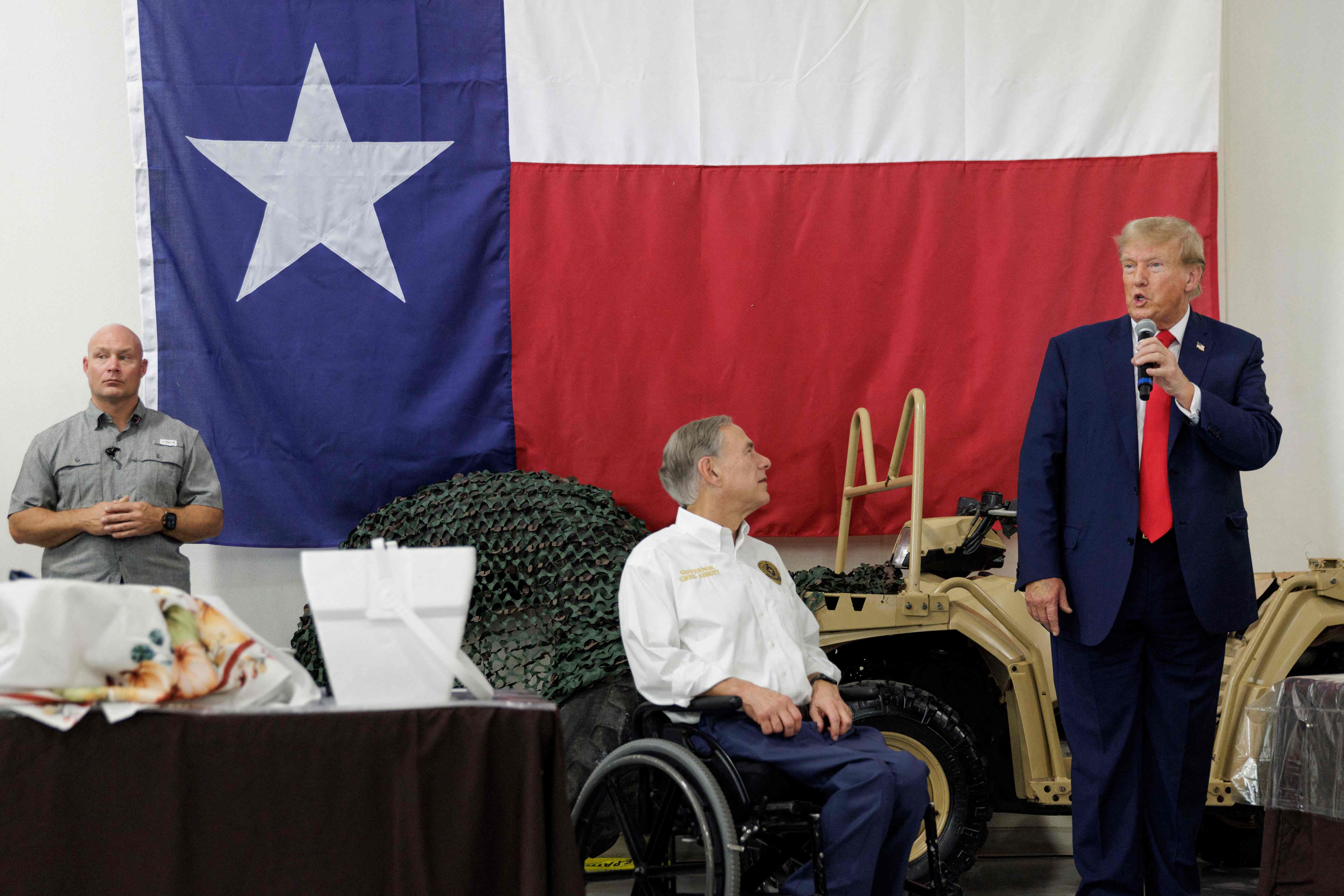 Donald Trump speaks next to Texas Governor Greg Abbott at the South Texas International airport on 19 November.