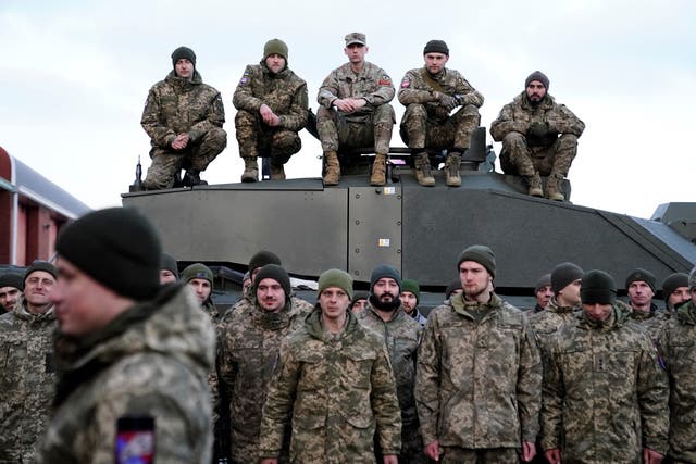<p>File: Soldiers gather as Volodymyr Zelensky and Britain’s prime minister Rishi Sunak meet Ukrainian troops being trained to command Challenger 2 tanks at a military facility in Lulworth, Dorset in southern England</p>