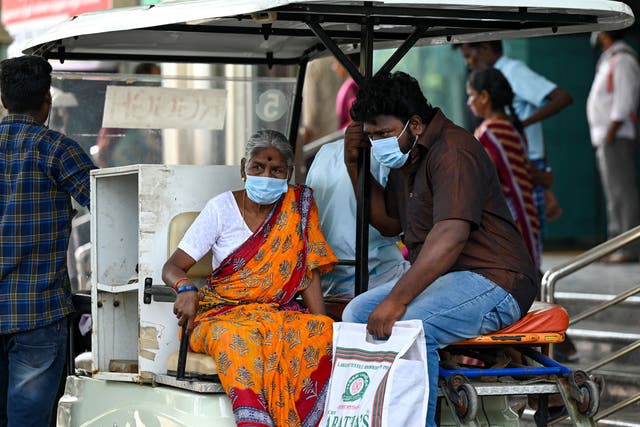 <p>People wear face masks as they arrive at a Chennai hospital </p>