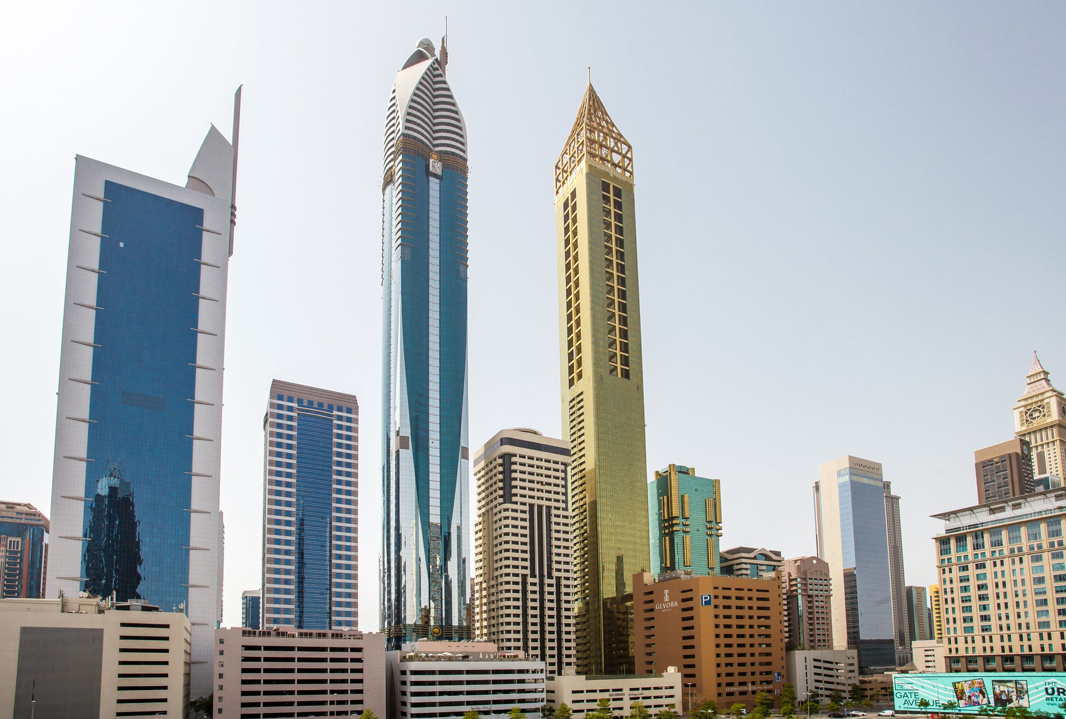 Dubai, UAE - April 17, 2022: skyscrapers on Sheikh Zayed Road - Gevora, Rose Rayhaan, 21st Century Tower, from behind.