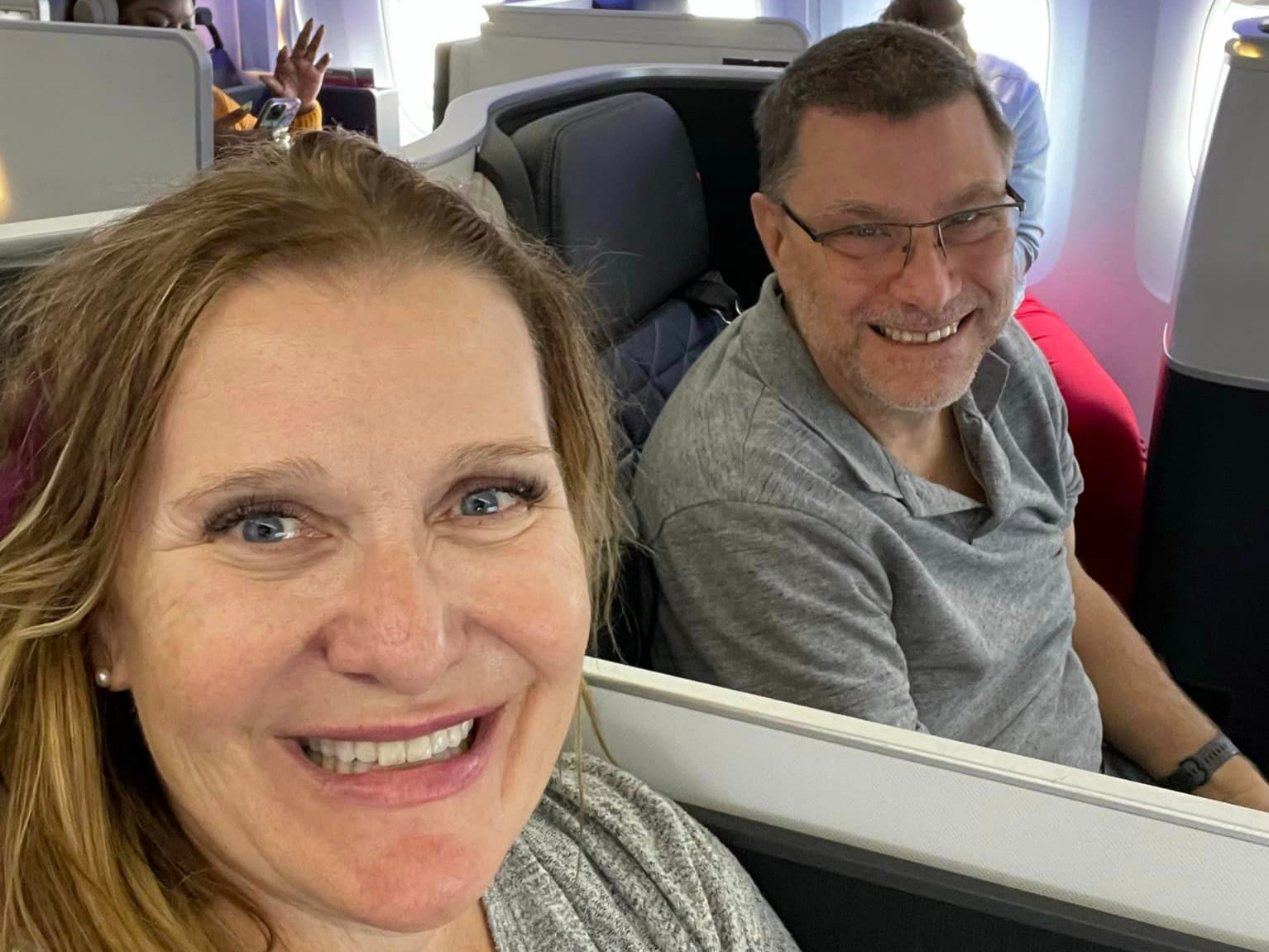 Jill and her husband use her airline points to upgrade on flights