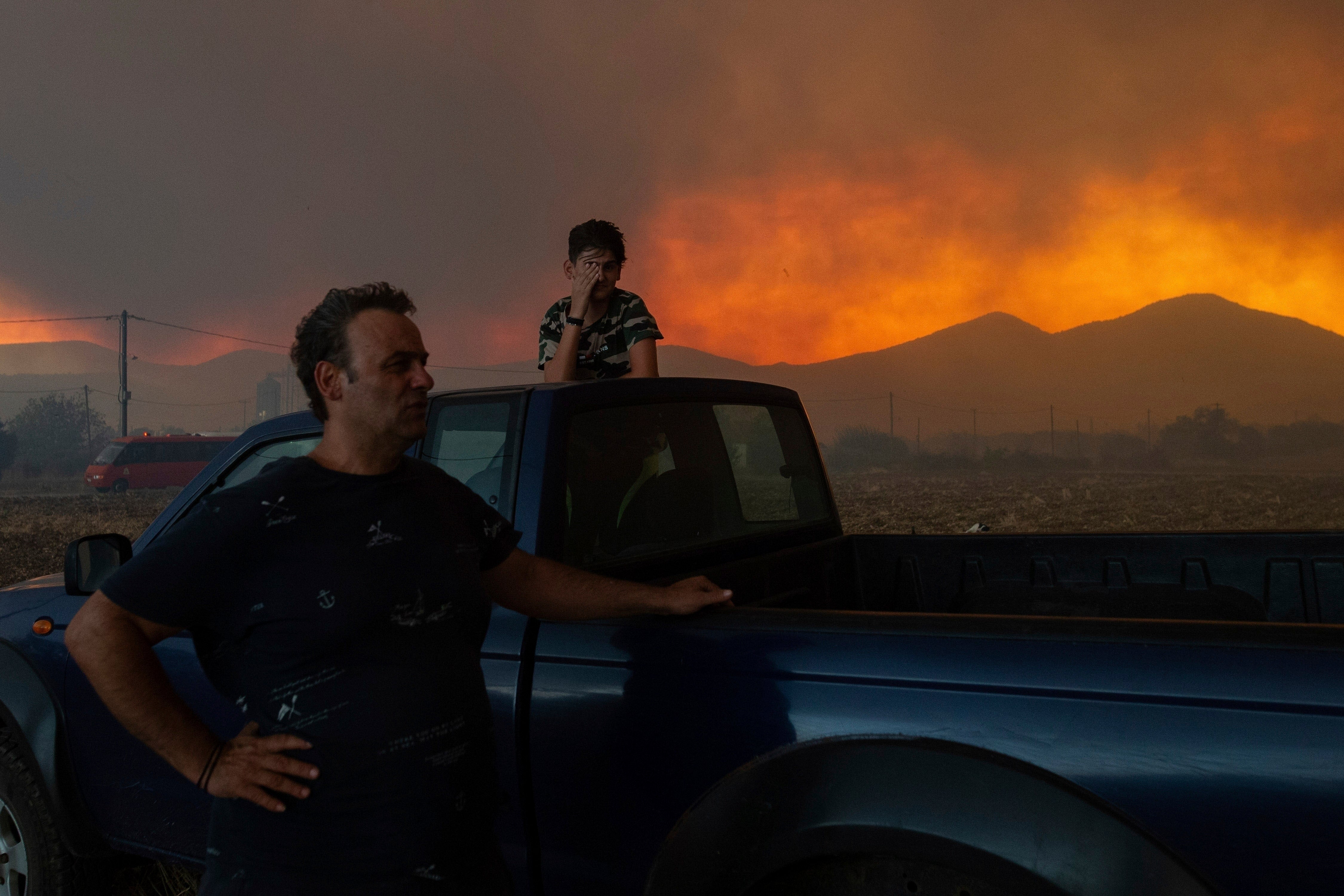 Local residents watch a wildfire in Avantas village, near Alexandroupolis, Greece, in August last year