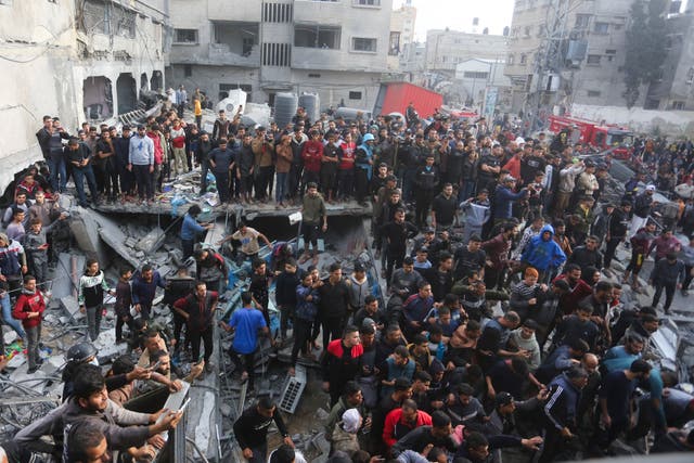 <p>Palestinians gather after an Israeli strike in Rafah, Gaza </p>