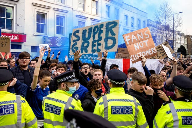 <p>Fans of Chelsea Football Club protest against the European Super League outside Stamford Bridge on April 20, 2021</p>