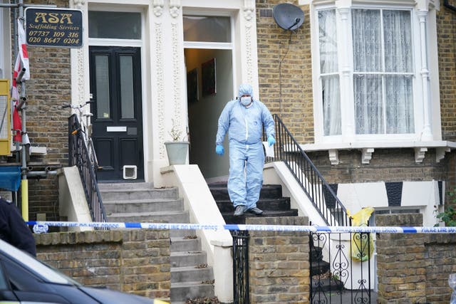 <p>Forensic officers at the scene of the incident in east London </p>