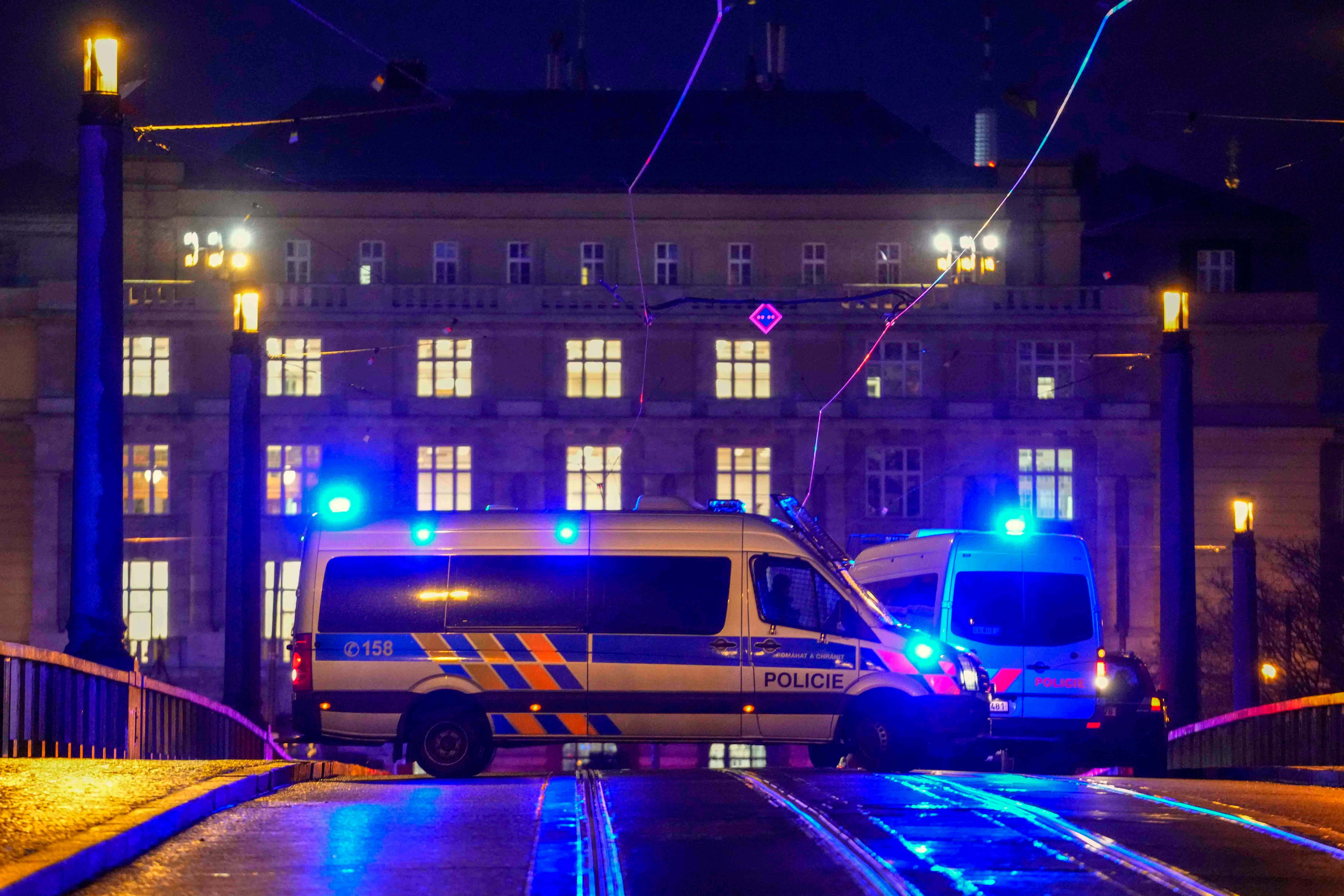 A police van blocks a bridge near the university