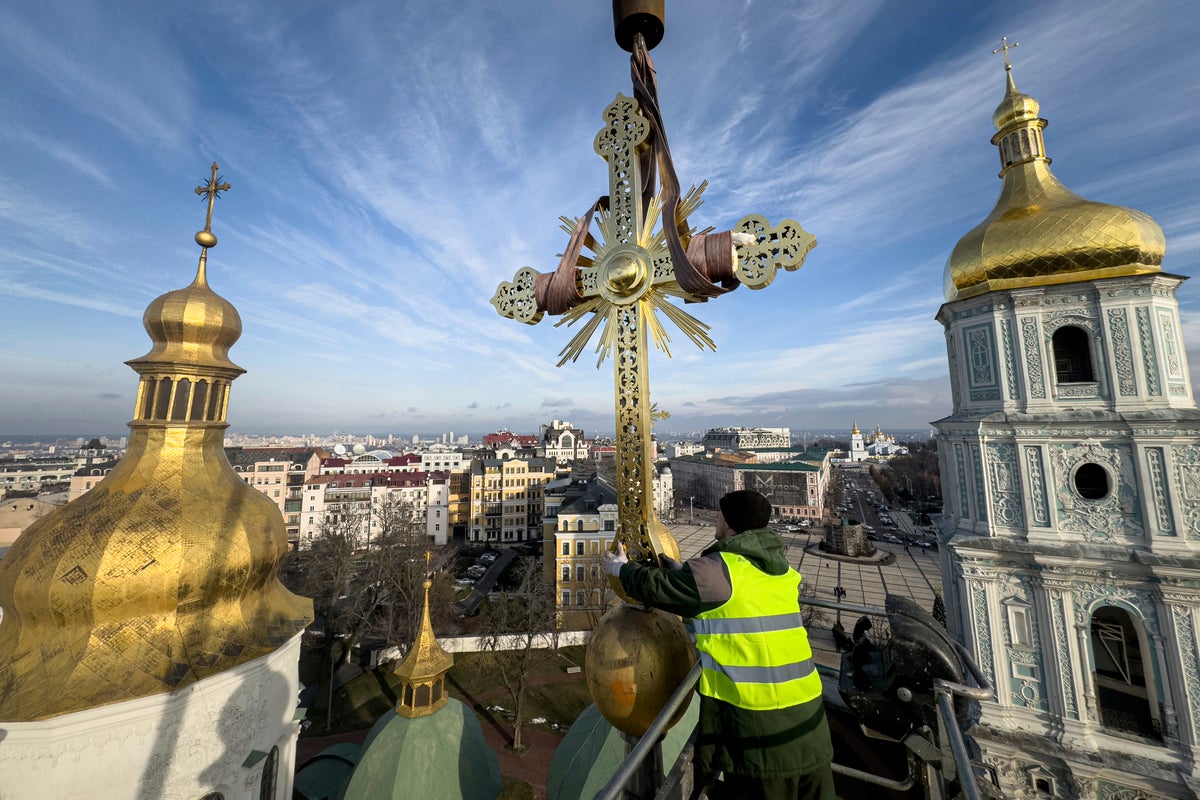 Authorities return restored golden crosses to the domes of Kyiv's St Sophia Cathedral