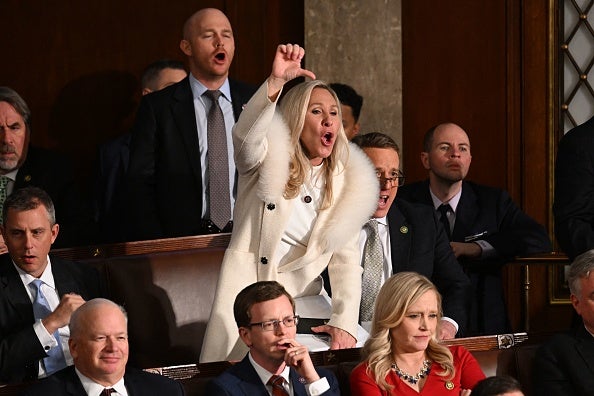 S Representative Marjorie Taylor Greene (R-GA) and Republican members of Congress react as US President Joe Biden delivers the State of the Union address in the House Chamber of the US Capitol in Washington, DC, on February 7, 2023.