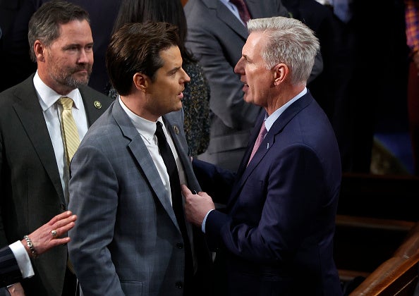 Kevin McCarthy (R-CA) (L) talks to Rep.-elect Matt Gaetz (R-FL) in the House Chamber on 6 January 2023