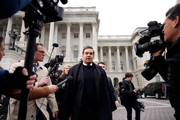 Rep. George Santos (R-NY) is surrounded by journalists as he leaves the U.S. Capitol after his fellow members of Congress voted to expel him from the House of Representatives on December 01, 2023 in Washington, DC.