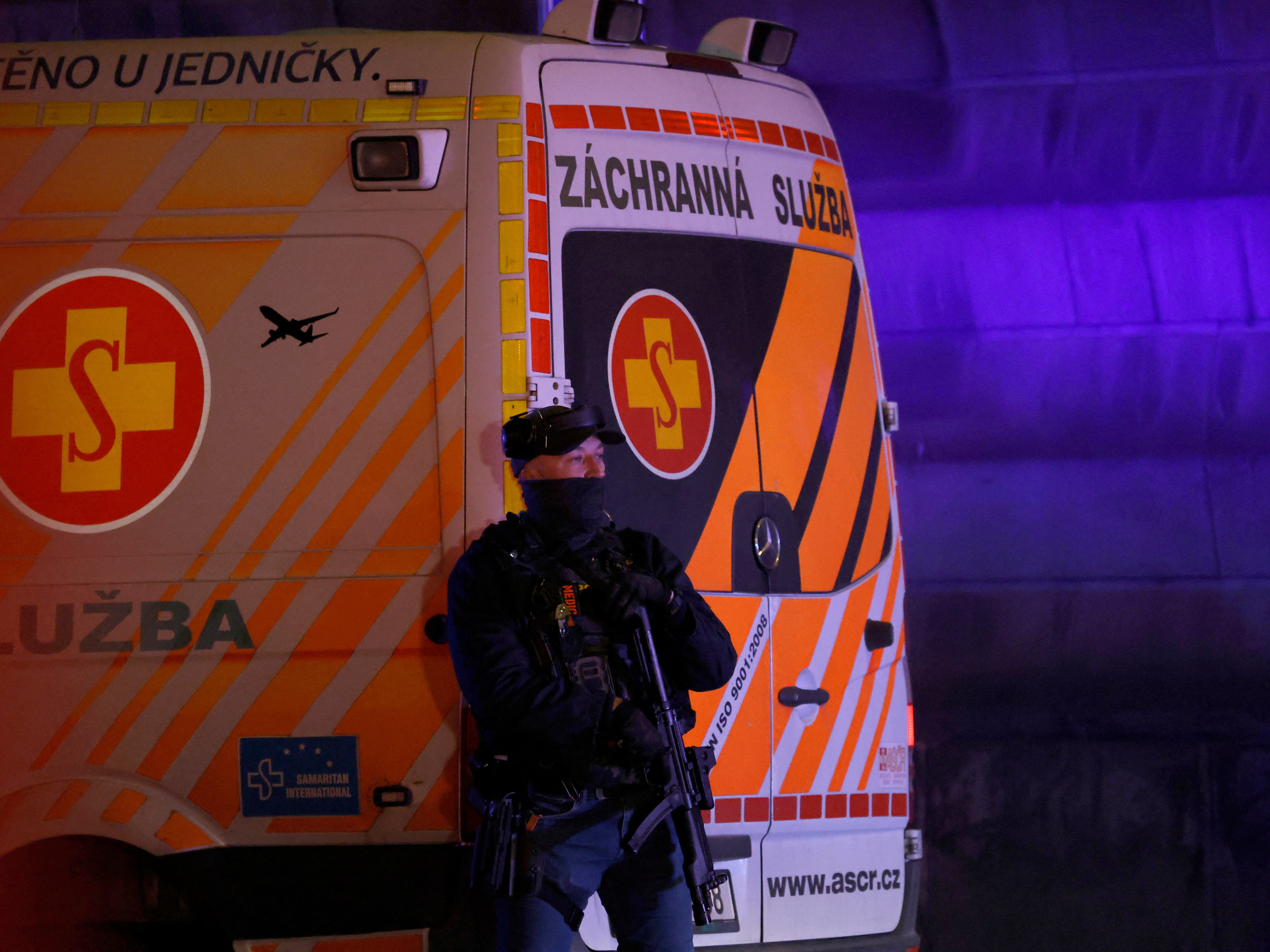 A police officer next to an ambulance near the area of the shooting