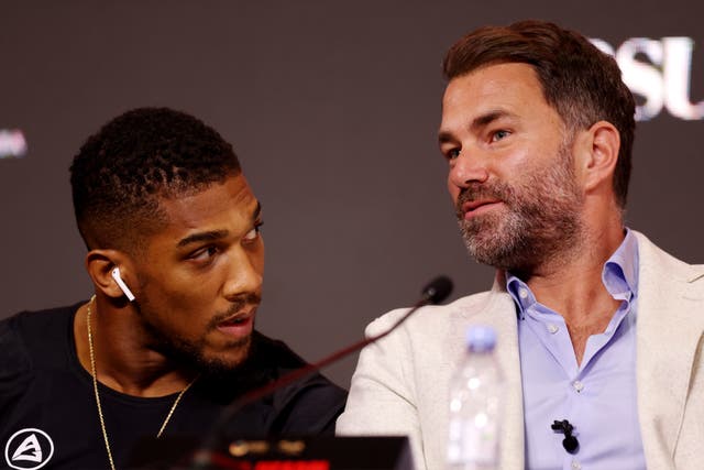 <p>Anthony Joshua (left) with his promoter Eddie Hearn</p>