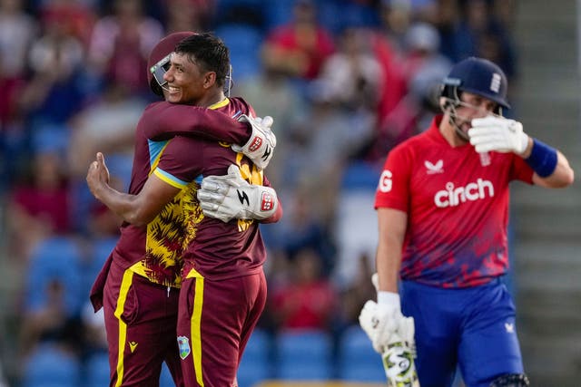 West Indies’ Gudakesh Motie celebrates taking the wicket of England’s Liam Livingstone (Ricardo Mazalan/AP)