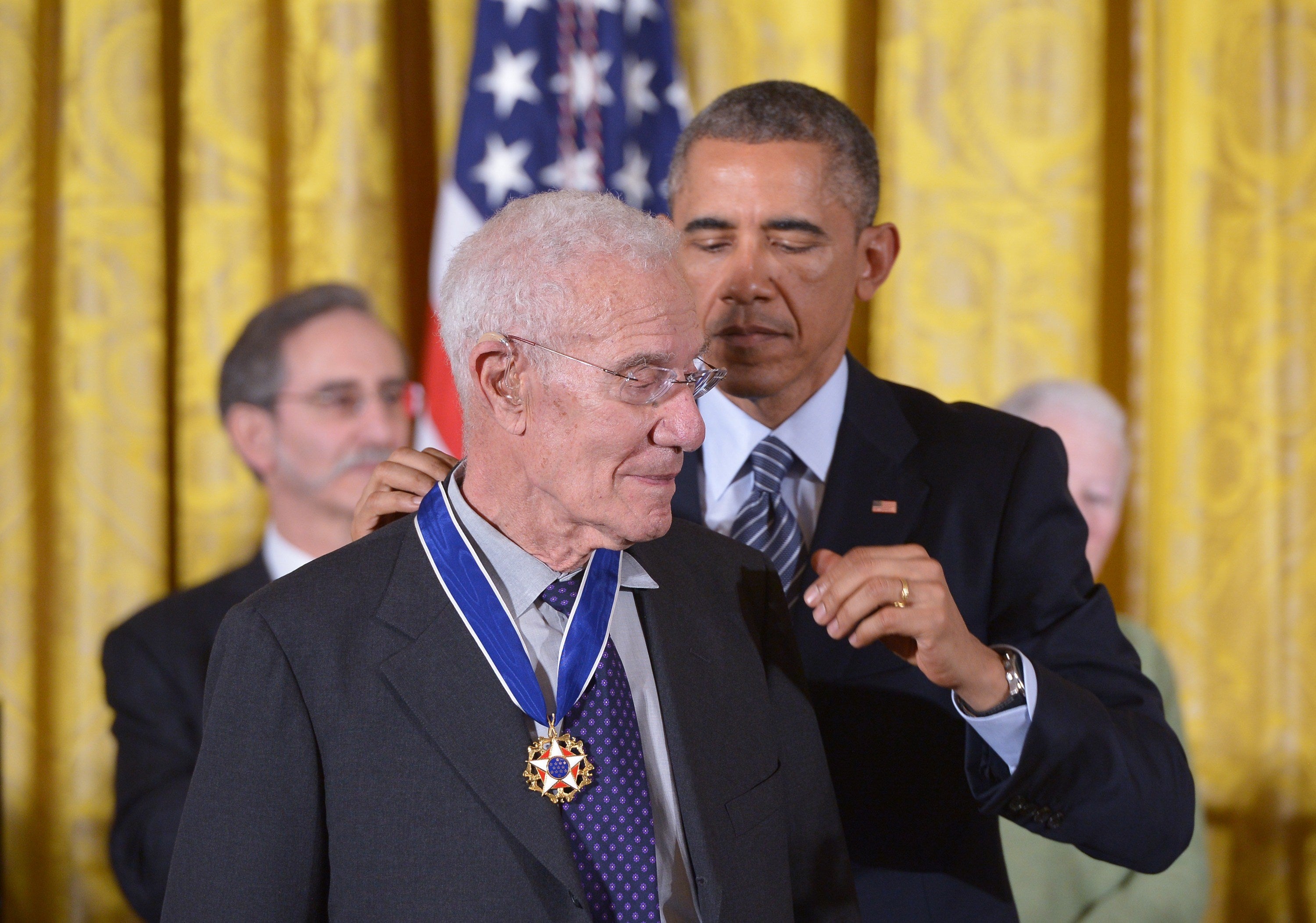 US President Barack Obama presents the Medal of Freedom to economist Robert Solow during a ceremony in the East Room of the White House on November 24, 2014 in Washington, DC