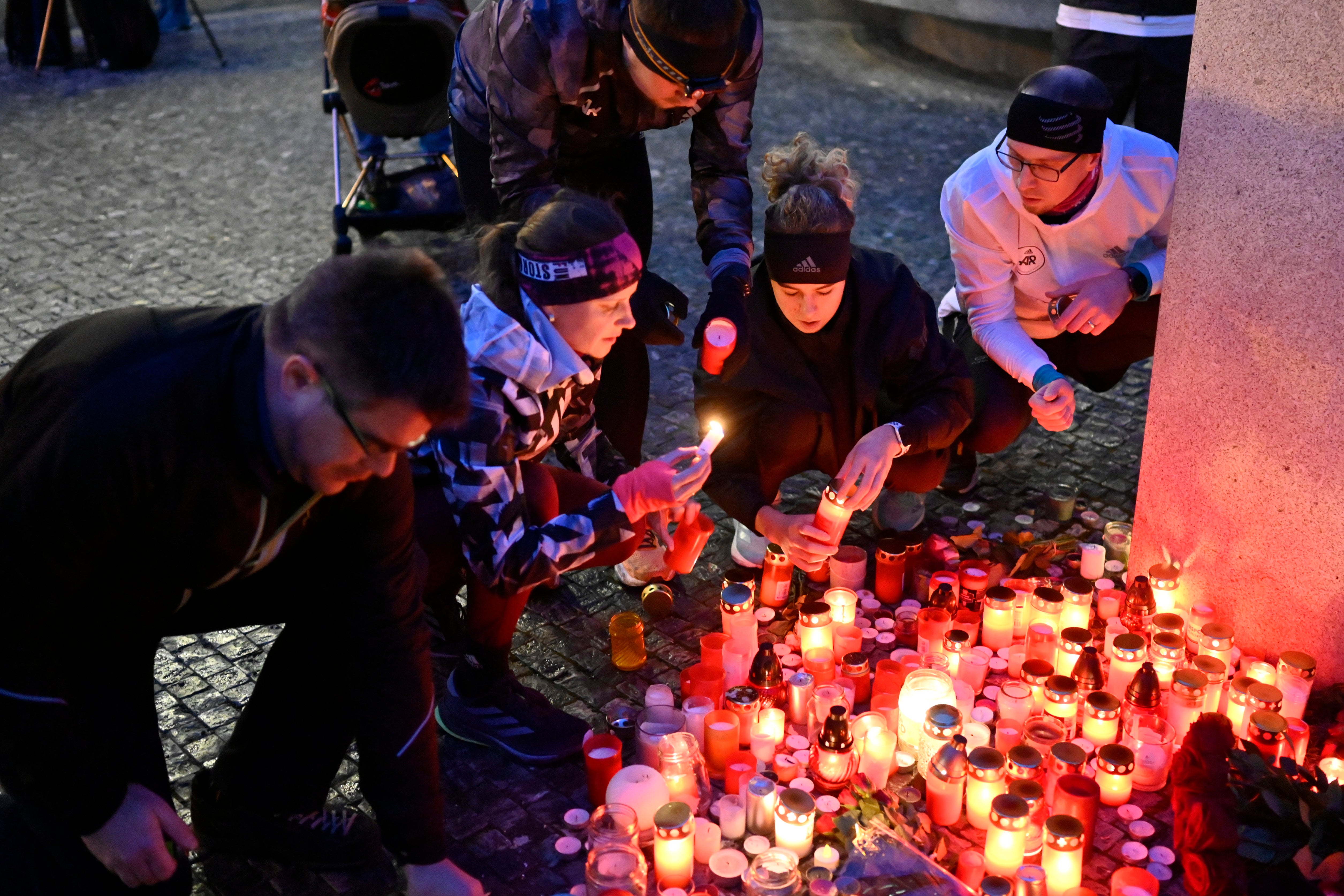 Mourners laying candles outside Charles University