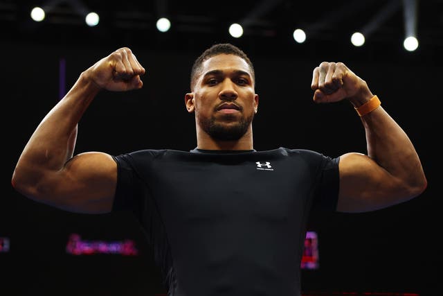 <p>Anthony Joshua reacts during the media workout for the Day of Reckoning</p>