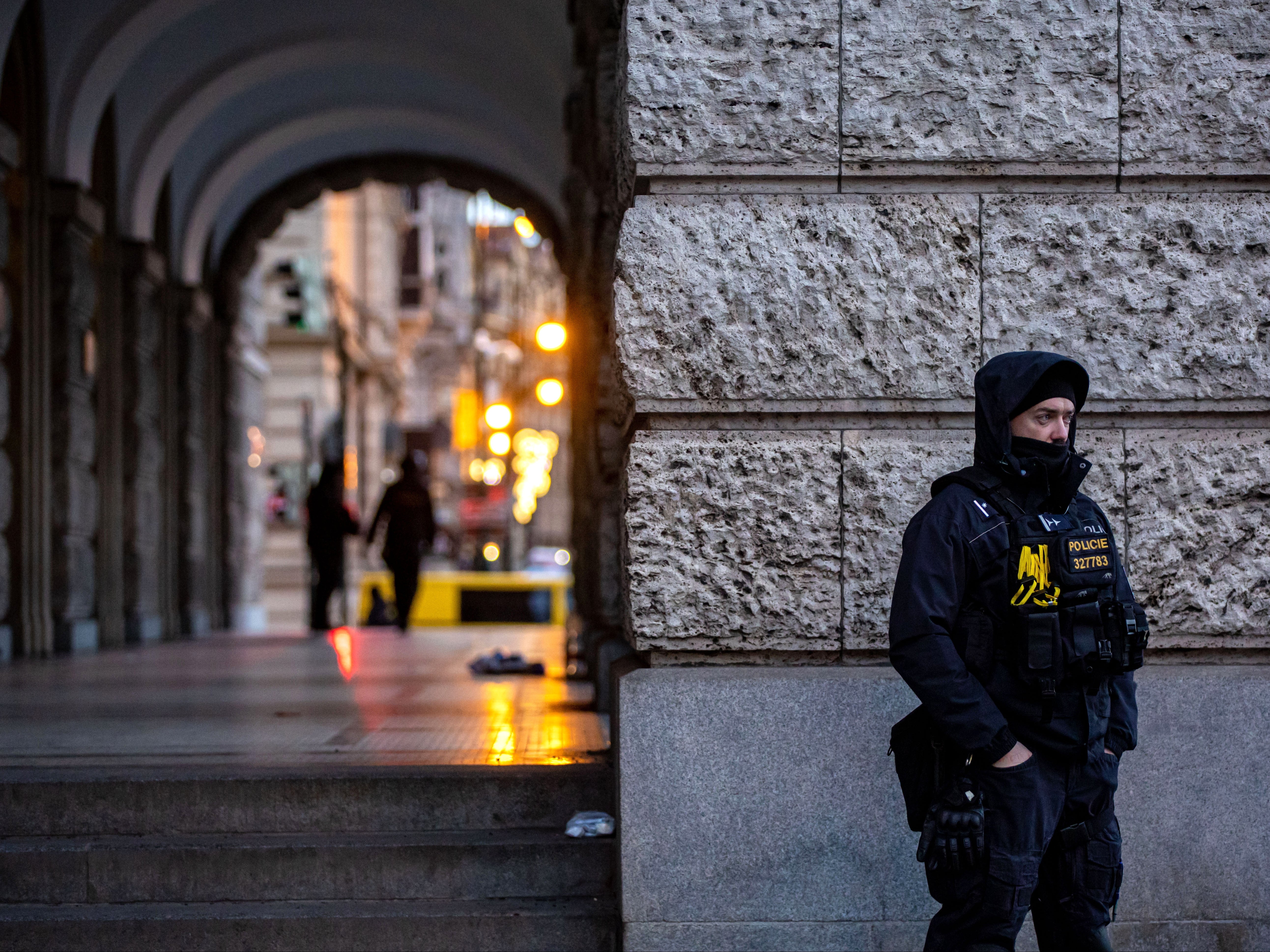 A police officer stands guard