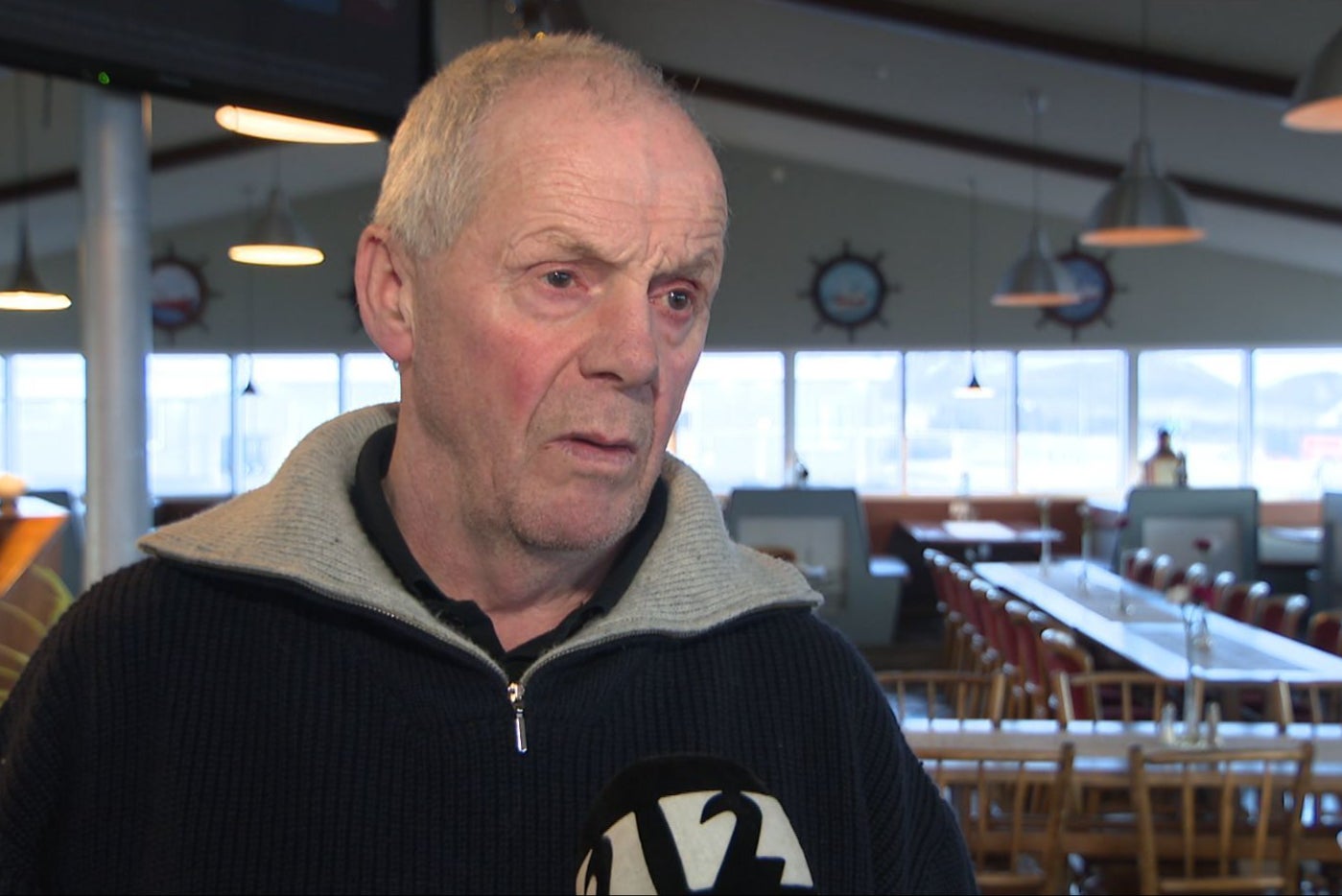 Ólaf Þórðarson speaks to local media after defying evacuation orders