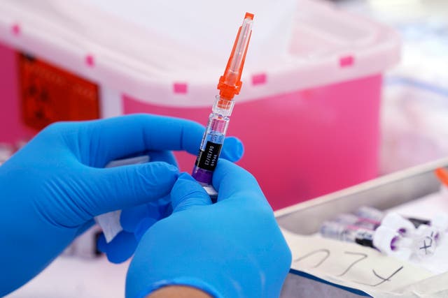 <p>A flu vaccine is readied in Lynwood, California</p>