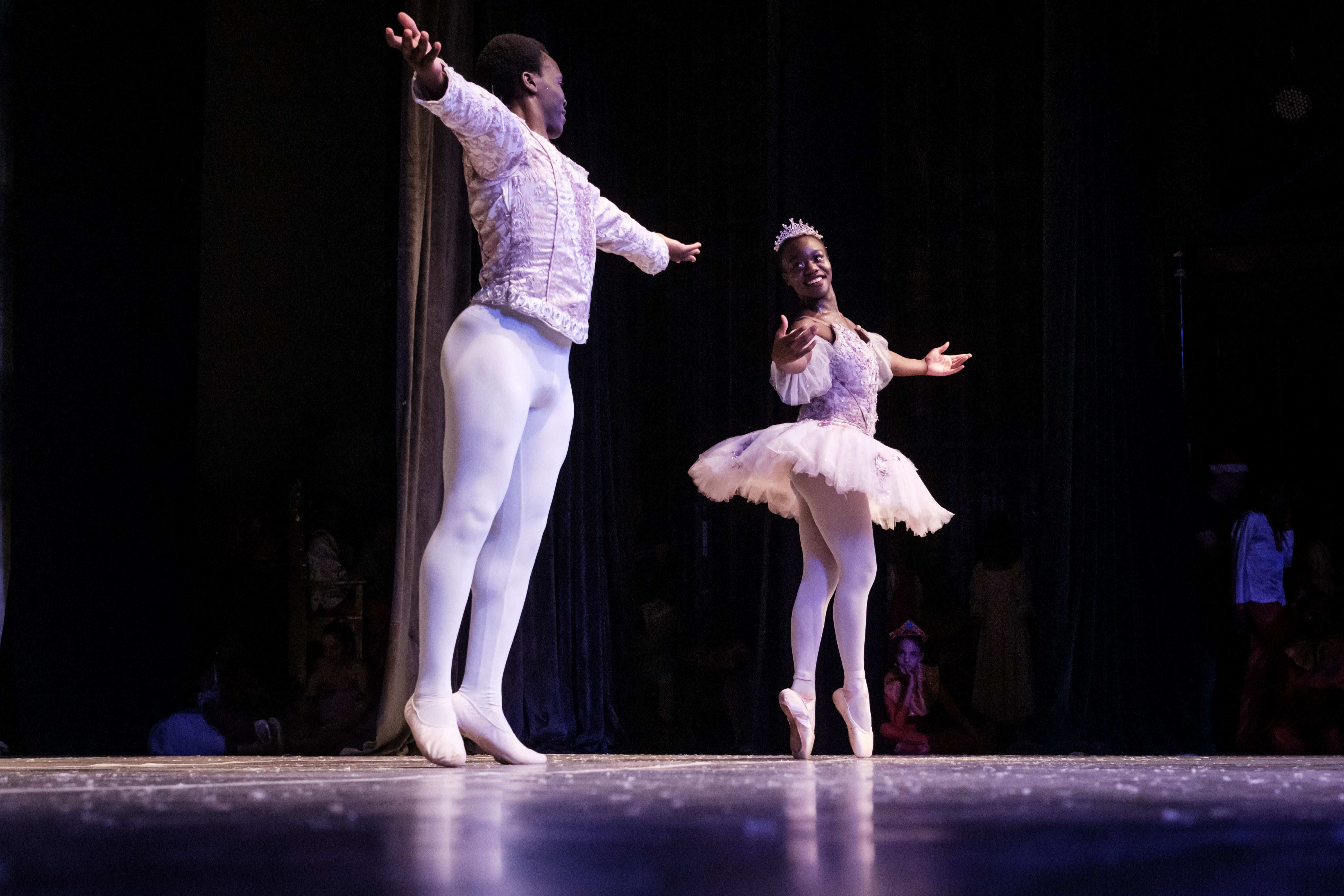 Pamela Atieno (right) and Shamick Otieno (left) dance during a production of ‘The Nutcracker’ by the Dance Centre Kenya (DCK) with the Nairobi Philharmonic Orchestra at the National Theatre in Nairobi on 4 December 2022