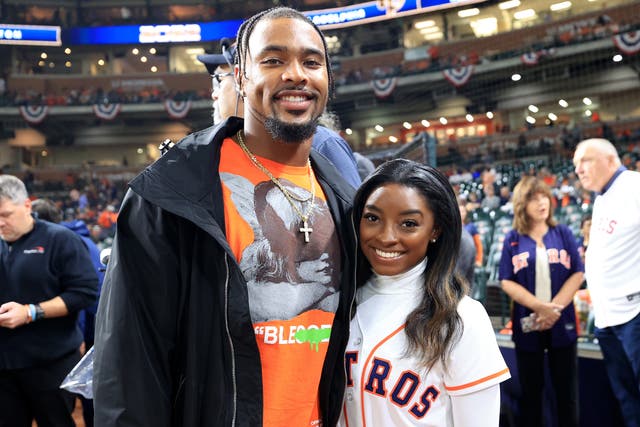 <p>Simone Biles and Jonathan Owens pose on the field prior to Game One of the 2022 World Series between the Philadelphia Phillies and the Houston Astros at Minute Maid Park on 28 October 2022 in Houston, Texas</p>