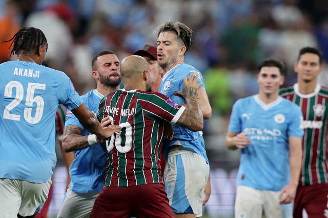 <p>Jack Grealish is confronted by Fluminense’s Felipe Melo</p>