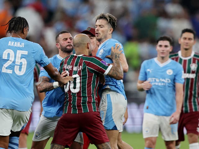 <p>Jack Grealish is confronted by Fluminense’s Felipe Melo</p>