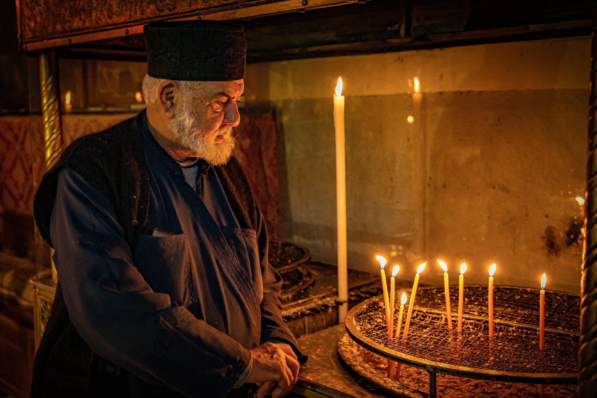Greek Orthodox priest Father Spiridon at the virtually empty Church of the Nativity in Bethlehem