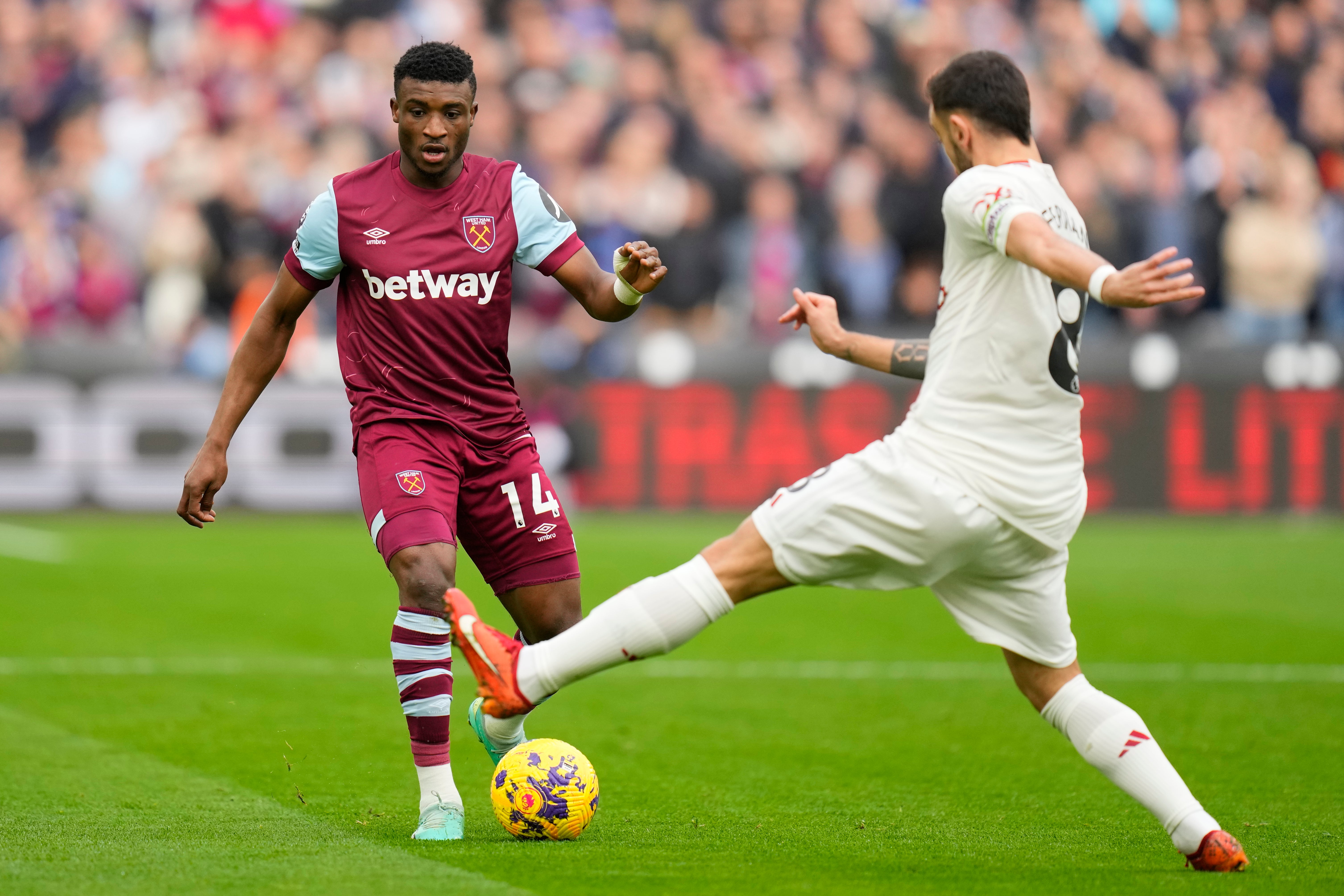 <p>Willy Kambwala warms up before kick-off at the London Stadium</p>