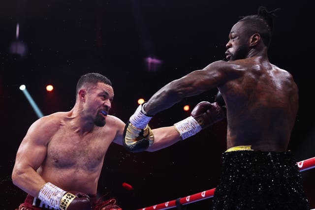 <p>Joseph Parker (left) pressuring Deontay Wilder in their fight in Saudi Arabia</p>