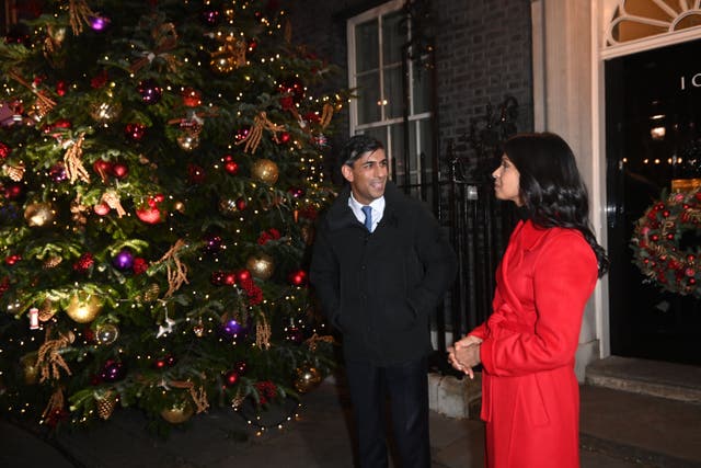 <p>Prime Minister Rishi Sunak and his wife Akshata Murty at the switching on of the Downing Street Christmas tree lights (Eddie Mulholland/Daily Telegraph/PA)</p>