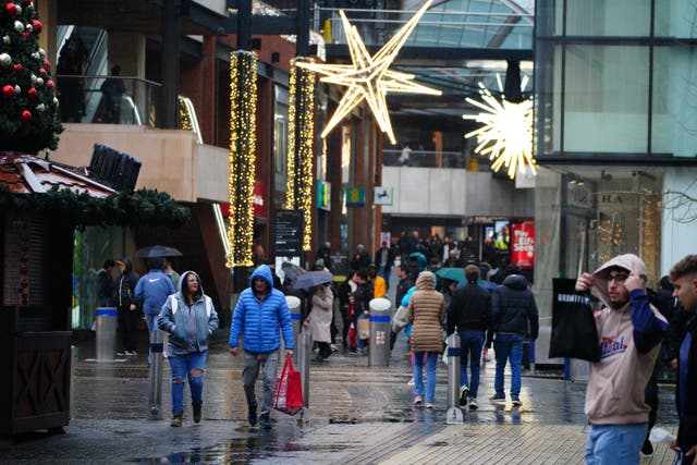 Shoppers in Broadmead, Bristol, ahead of Christmas Day (Ben Birchall/PA)
