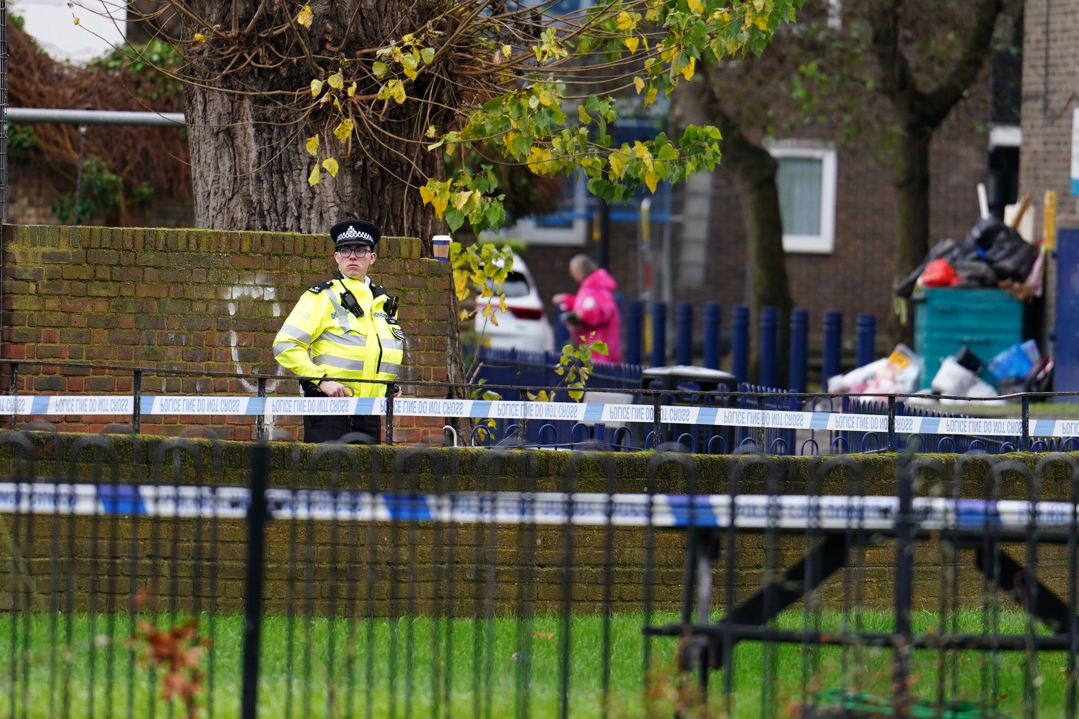 A Metropolitan Police officer at the scene outside Spenlow House in Jamaica Road, Bermondsey, south-east London, where a 22-year-old woman died from a stab injury on Christmas Eve (Jordan Pettitt/PA)