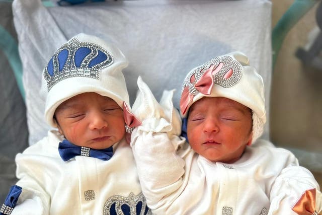 <p>Jami (left) and his sister Rumi, who were born either side of midnight</p>