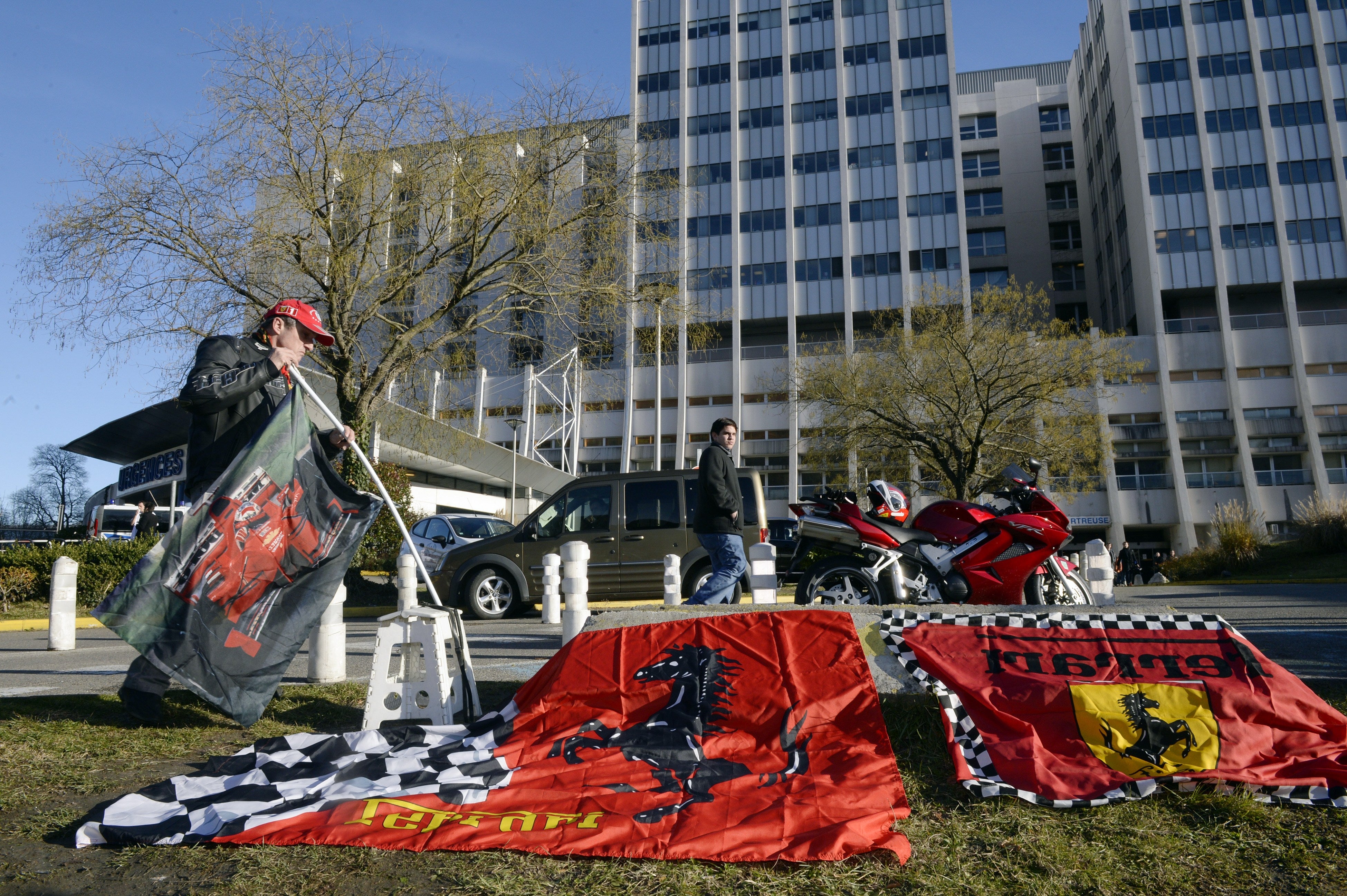 Ferrari flags were left by fans outside Grenoble University Hospital Centre following the December 2013 accident