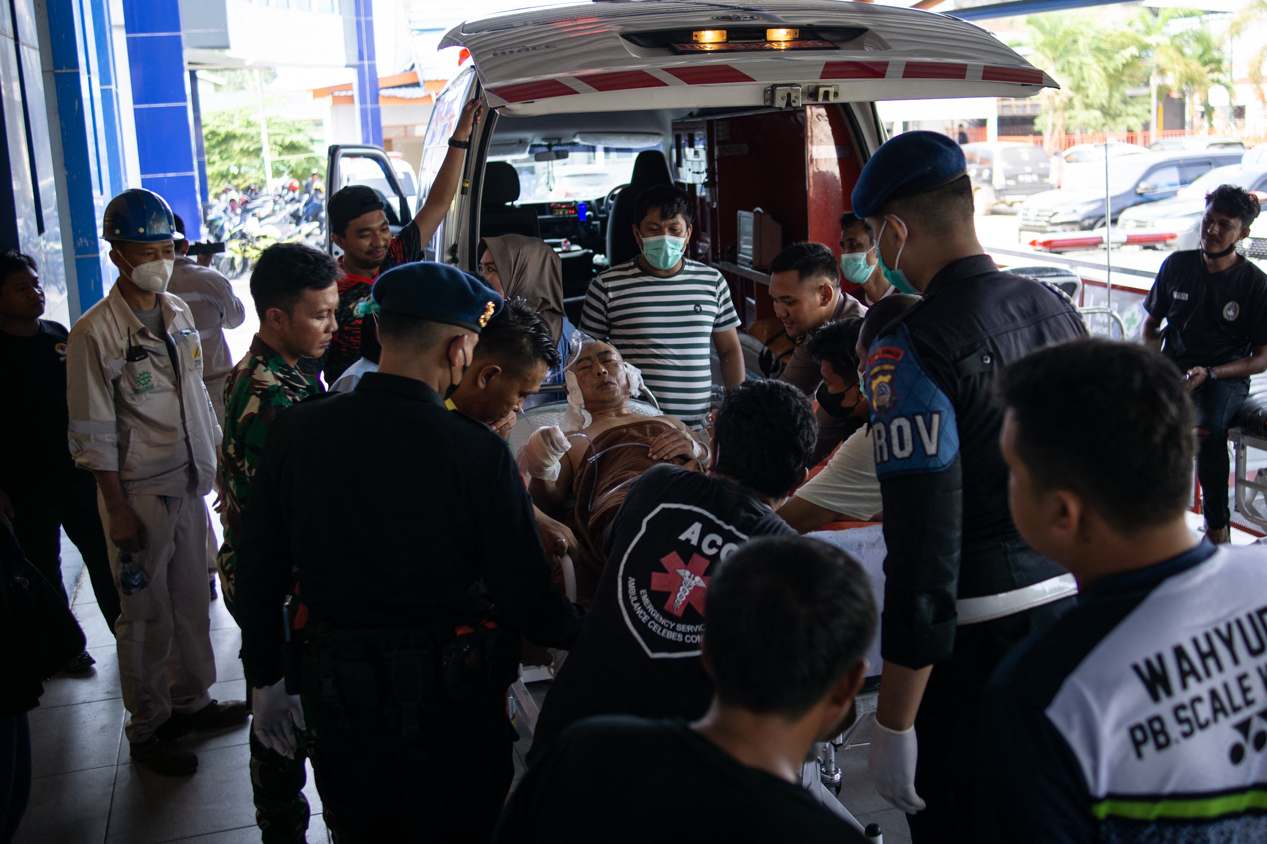 A Chinese worker who was injured in the explosion at a nickel smelter furnace is brought to the Morowali Regional General Hospita