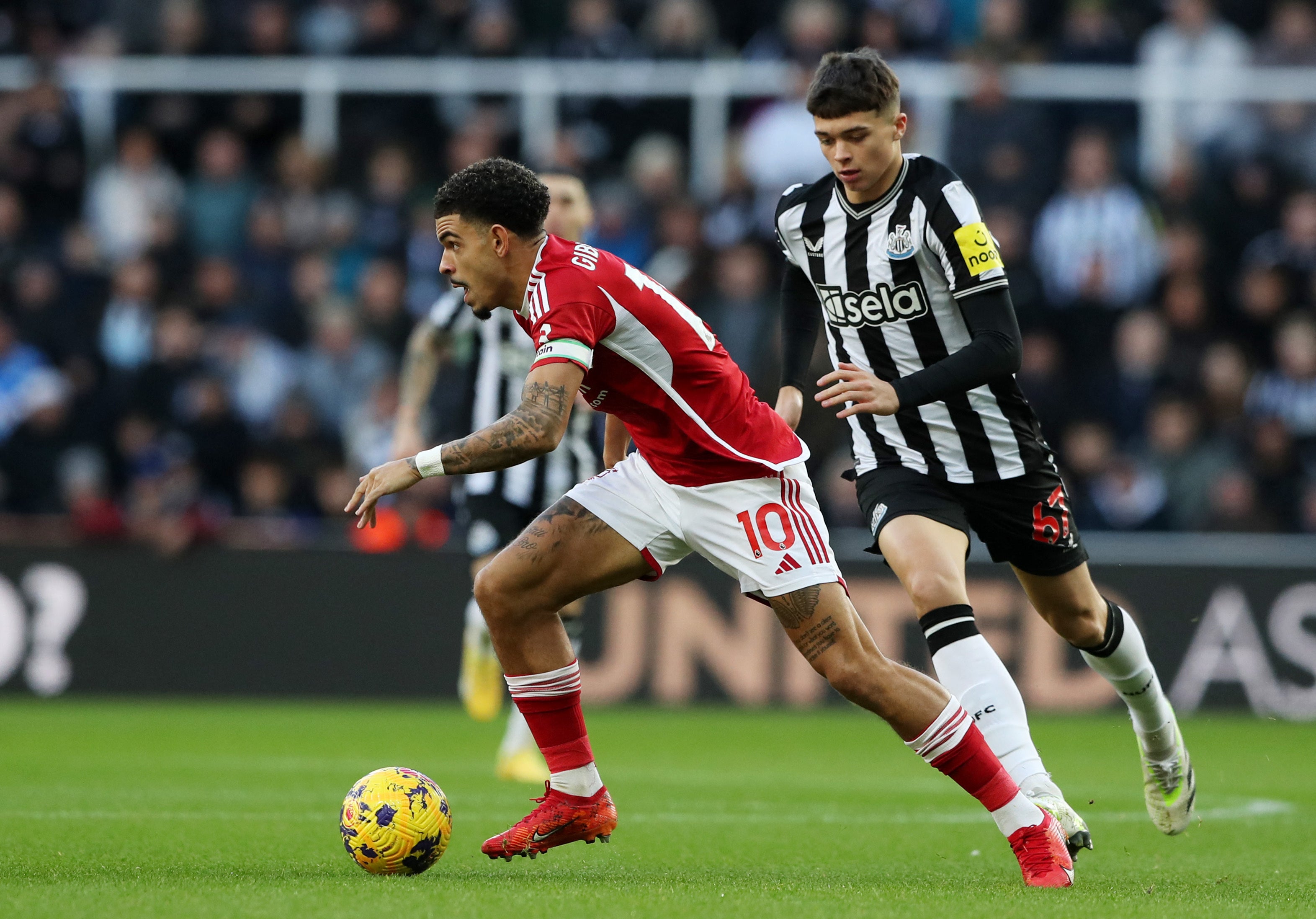 Nottingham Forest's Morgan Gibbs-White in action with Newcastle United's Lewis Miley