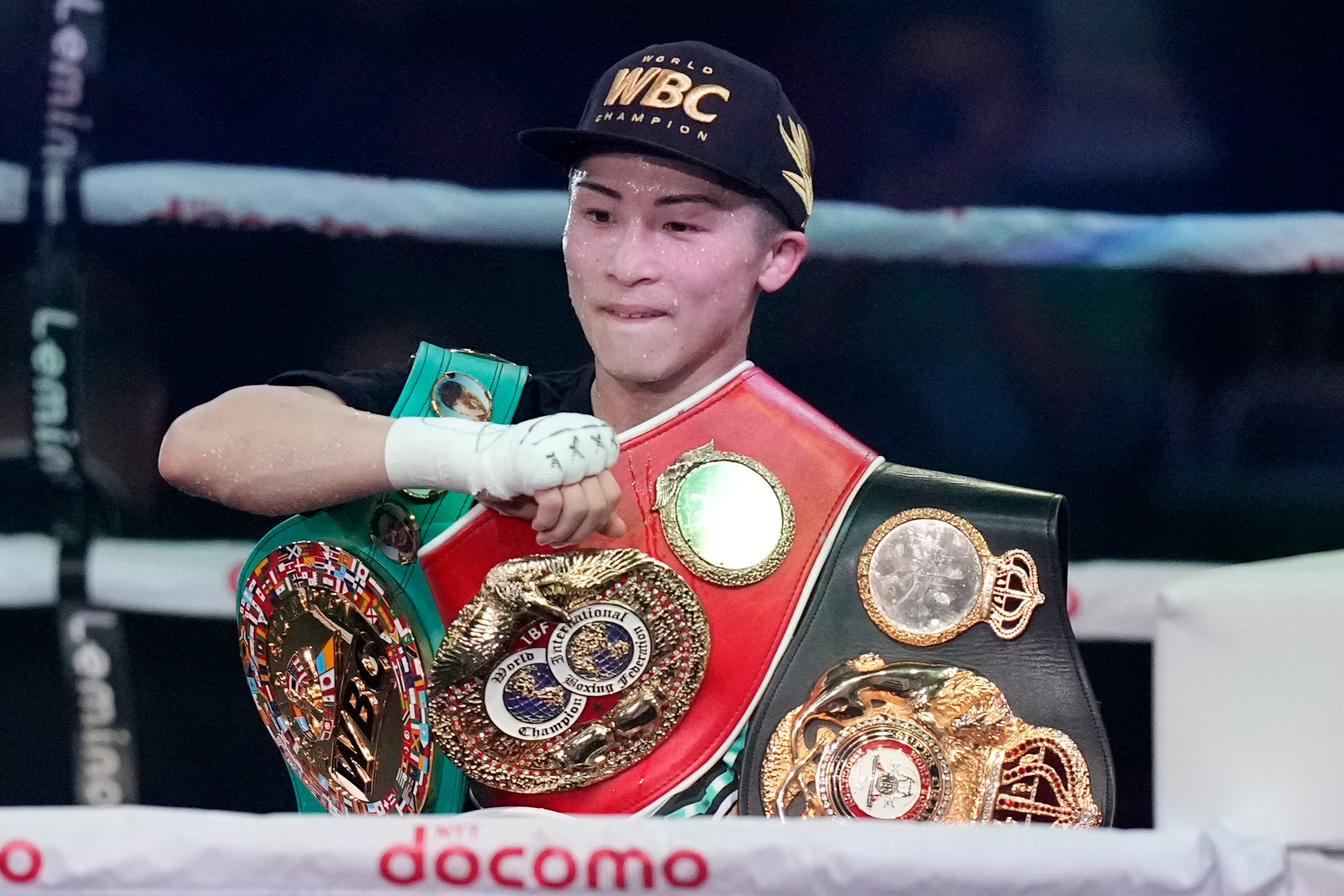 Naoya Inoue celebrates becoming undisputed champion in a second division