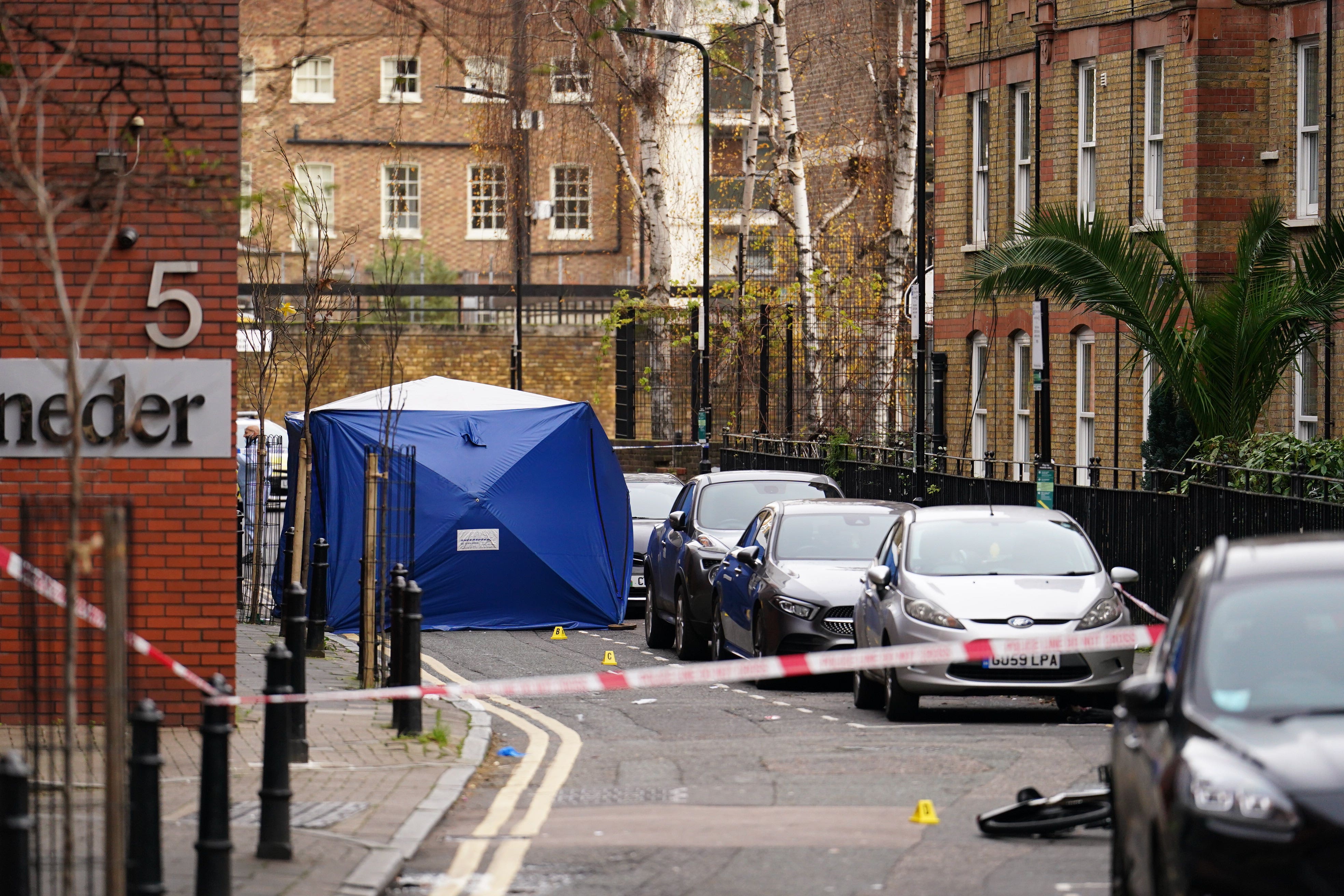 A police investigation tent outside a property in Cranwood Street, central London (Jordan Pettitt/PA)