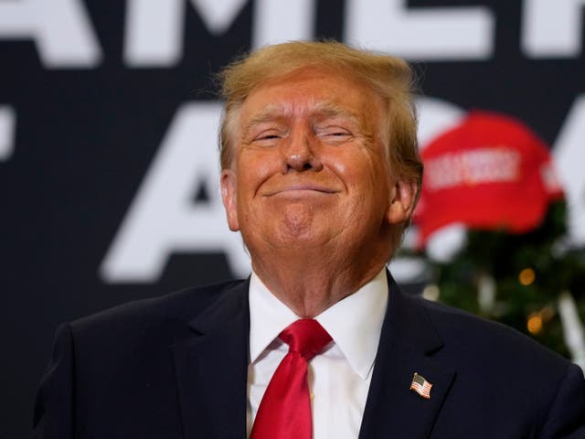 <p>Trump revels in his supporters’ praise at a caucus rally in Iowa on 19 December 2023</p>