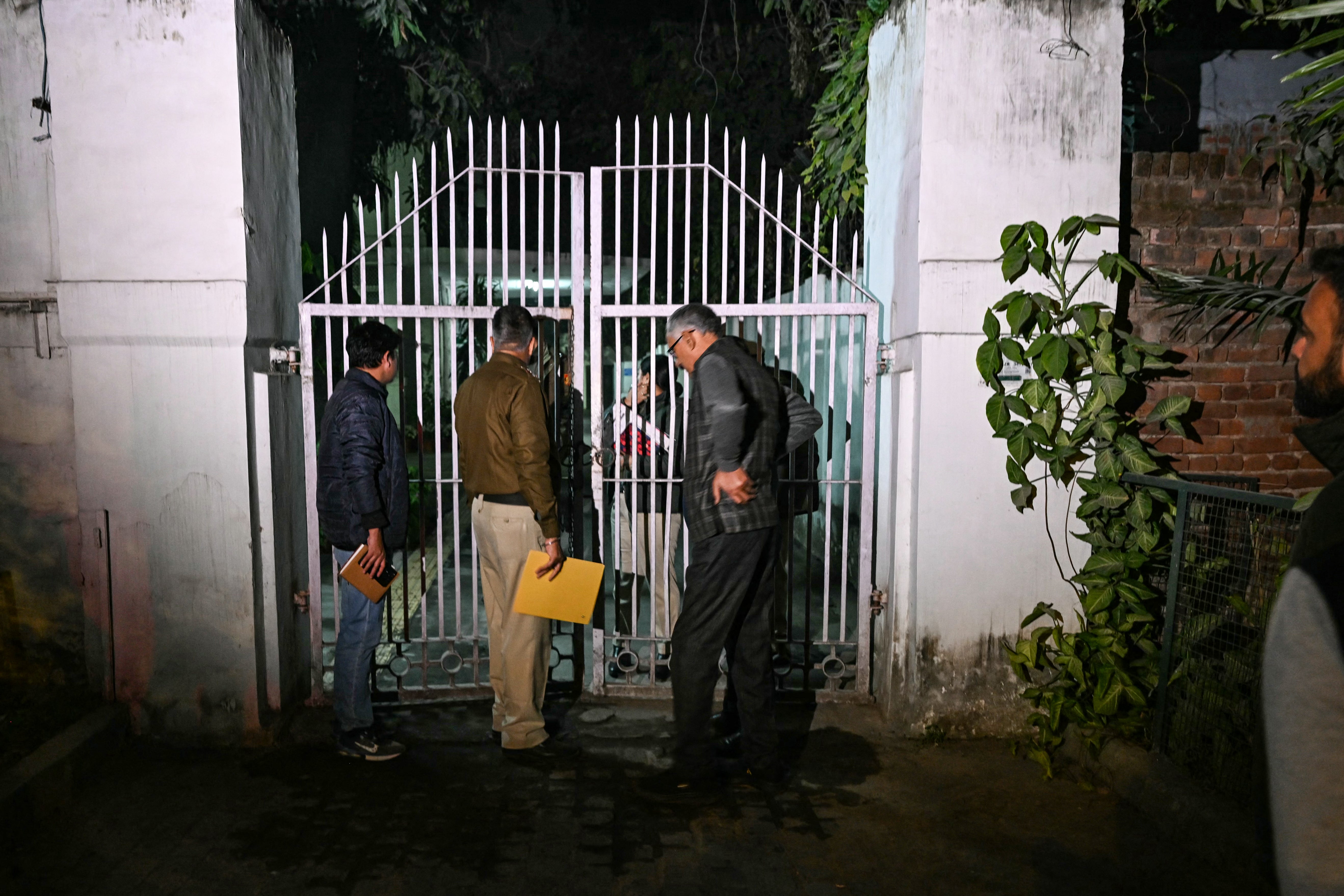Police personnel conduct an investigation after an alleged explosion took place near the Israeli embassy in New Delhi
