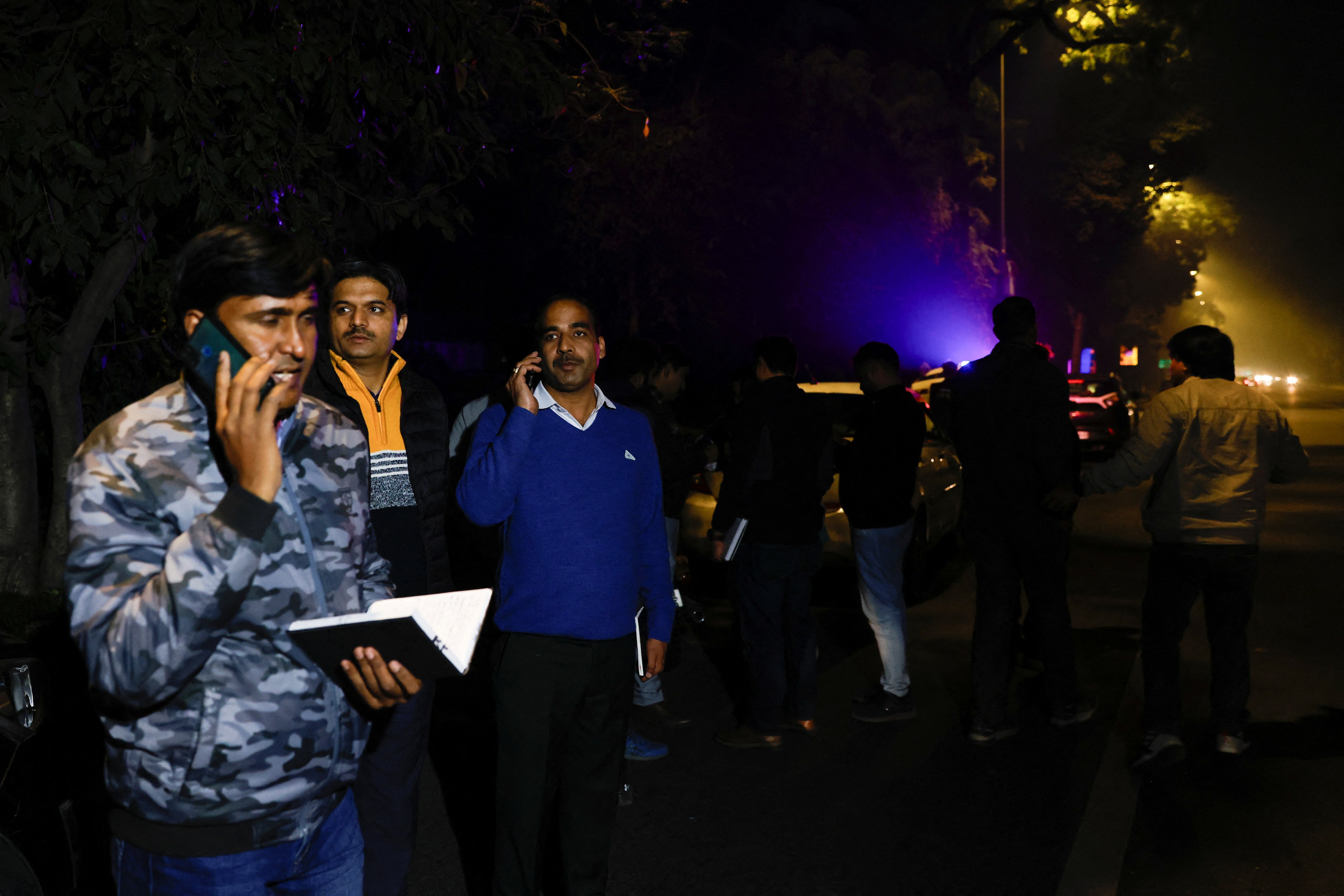 Police officials gather outside the Israeli embassy, following a reported explosion nearby, in New Delhi